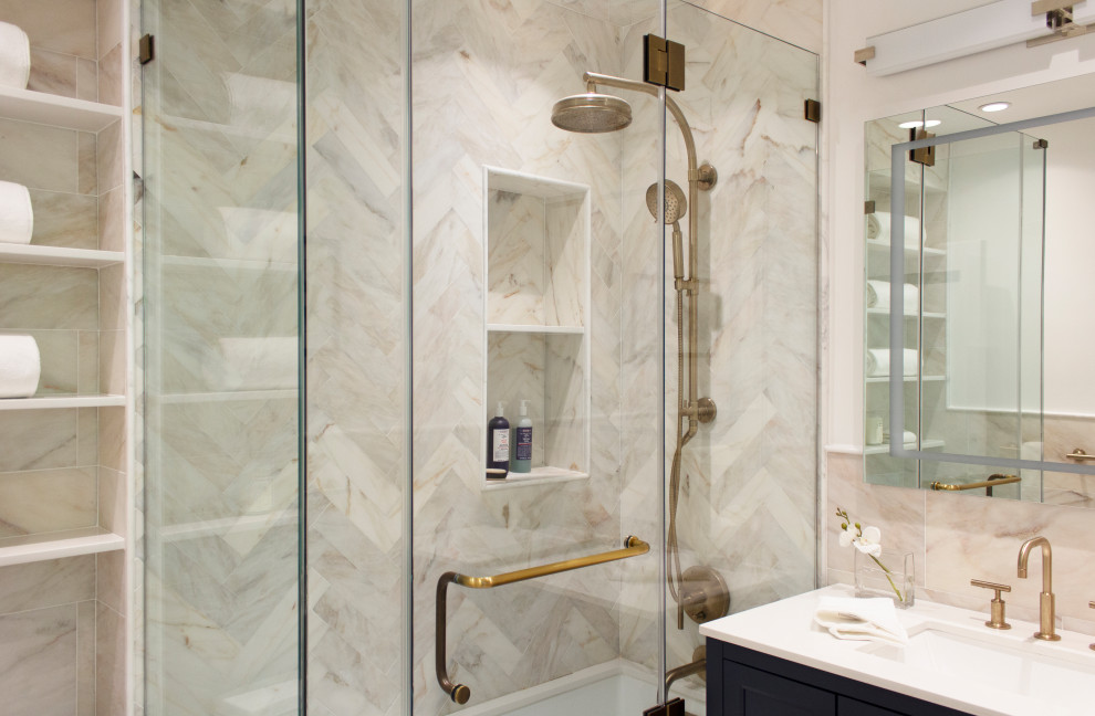 This is an example of a small transitional master bathroom in Other with shaker cabinets, blue cabinets, an undermount tub, an alcove shower, a one-piece toilet, beige tile, marble, beige walls, marble floors, an undermount sink, engineered quartz benchtops, beige floor, a hinged shower door, white benchtops, a niche, a single vanity and a freestanding vanity.