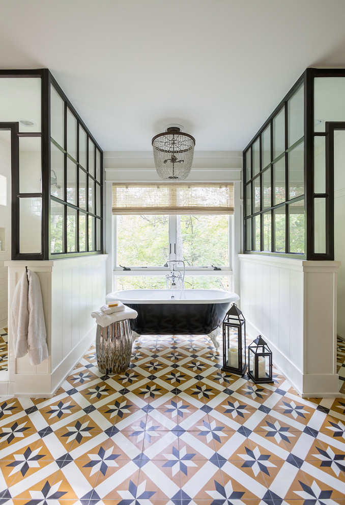 Large transitional master bathroom in Los Angeles with a claw-foot tub, a double shower, multi-coloured floor, white tile, a hinged shower door, medium wood cabinets, white walls, ceramic floors and an undermount sink.