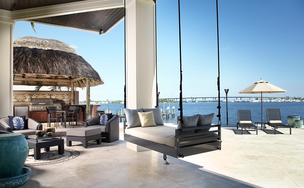 Photo of a transitional patio in Miami with a gazebo/cabana.