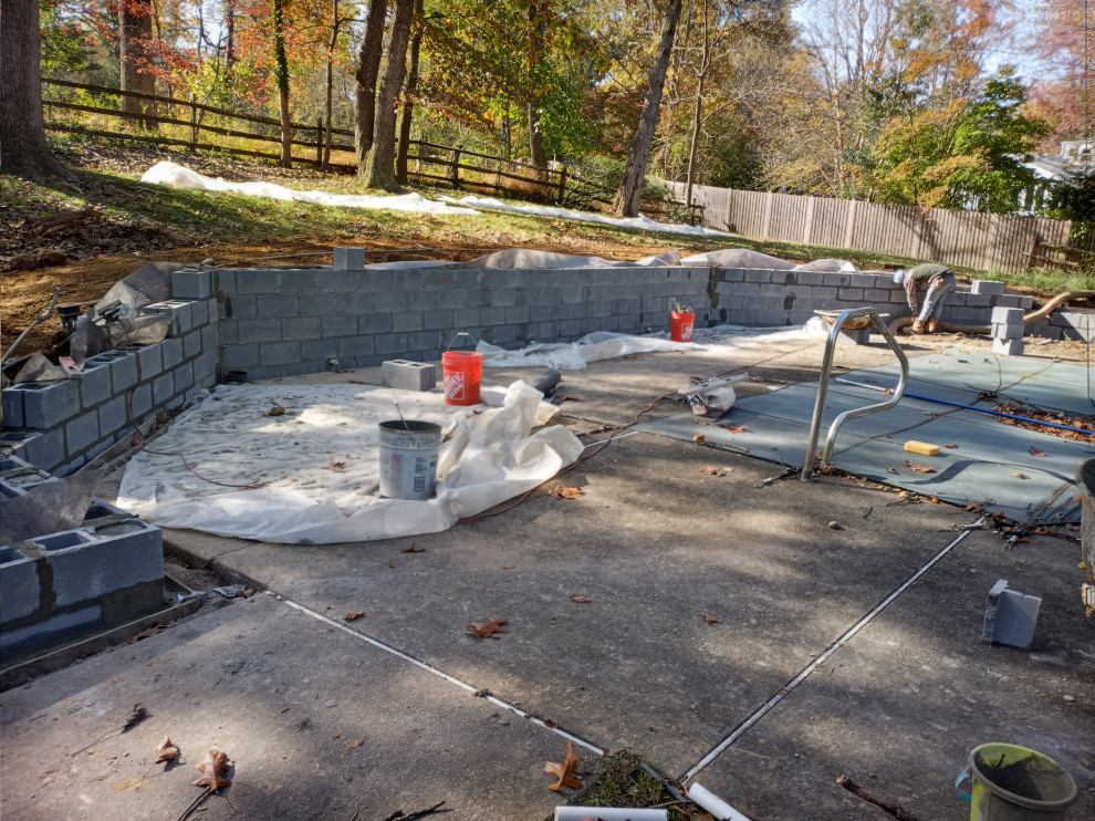 STONE FIREPLACE  , BBQ GRILL   AND STONE RETAINING WALL