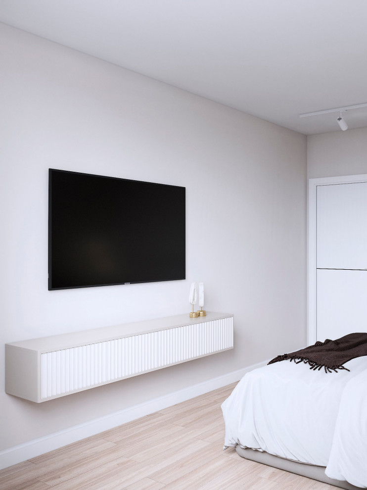 This is an example of a small scandinavian master bedroom in London with grey walls and beige floor.