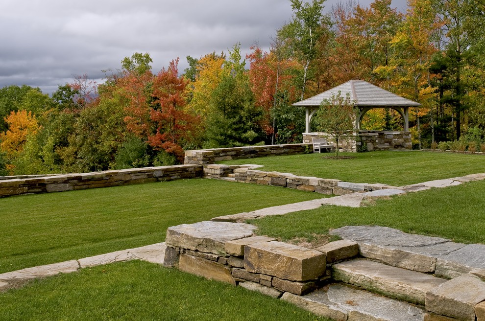 Photo of a large traditional backyard garden in Burlington.