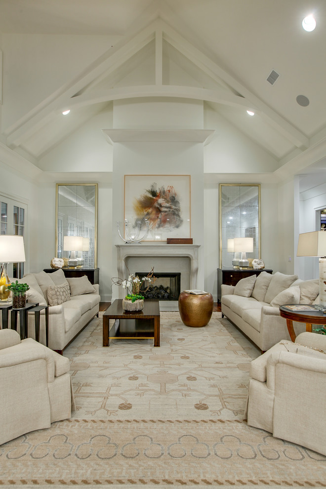 Elegant formal living room photo in Nashville with white walls and a standard fireplace