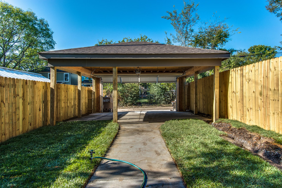 Photo of a mid-sized traditional detached two-car carport in Nashville.