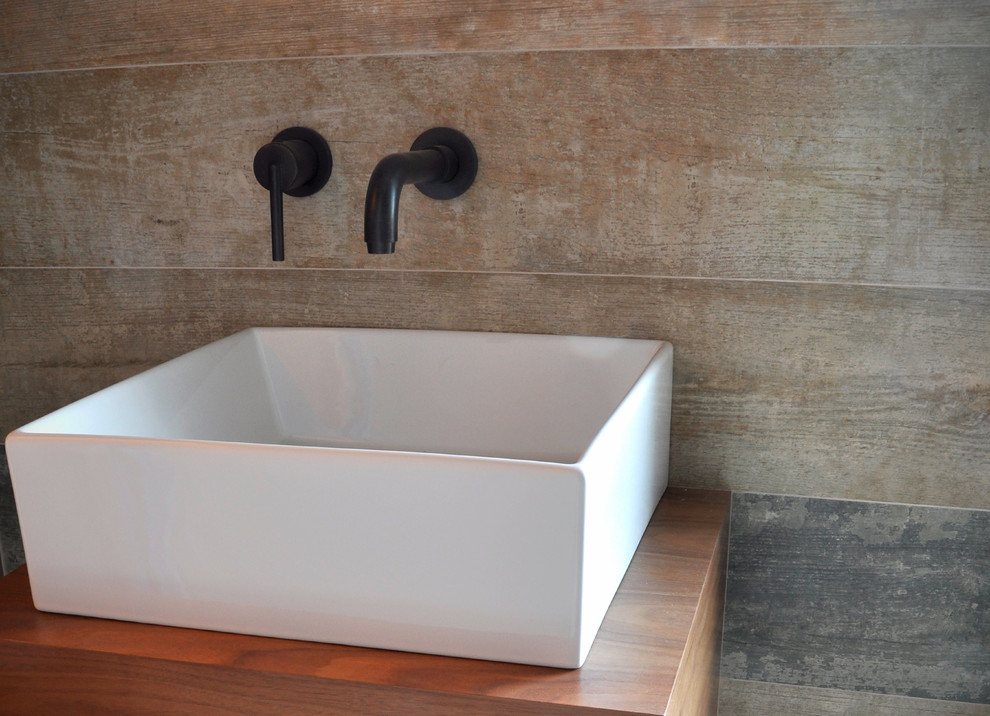 Photo of a midcentury bathroom in San Diego with a vessel sink.
