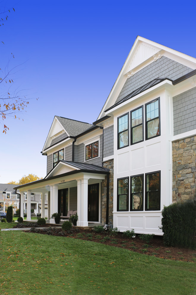 Example of a large arts and crafts gray two-story mixed siding exterior home design in DC Metro with a shingle roof