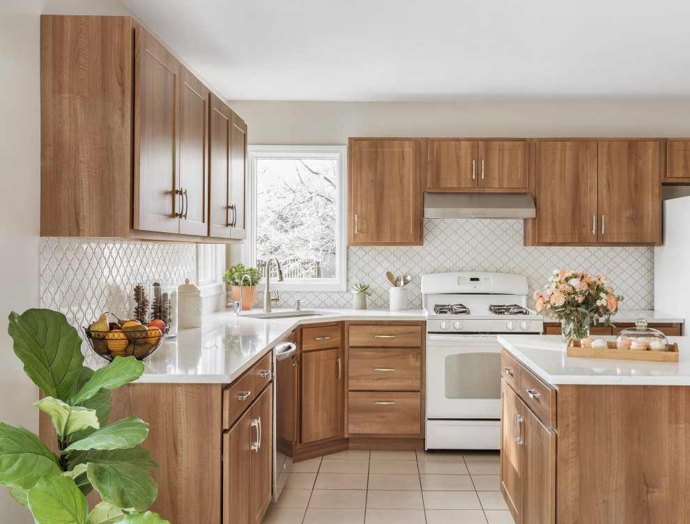 Example of a large transitional l-shaped cement tile floor and white floor eat-in kitchen design in Philadelphia with a single-bowl sink, flat-panel cabinets, medium tone wood cabinets, quartzite countertops, white backsplash, ceramic backsplash, stainless steel appliances, an island and white countertops