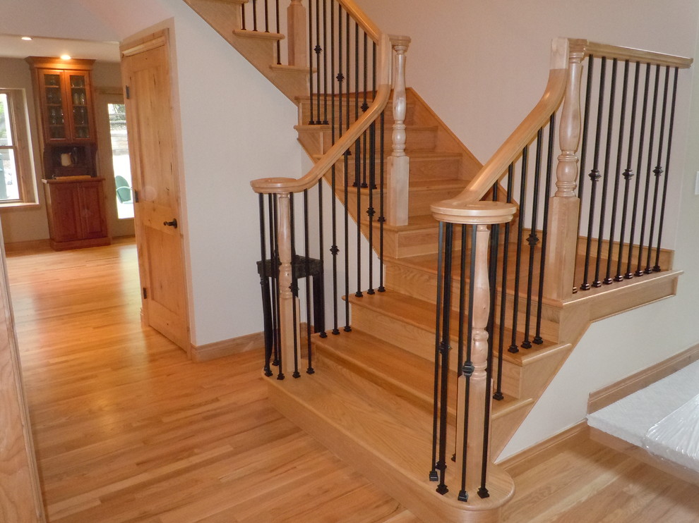 Inspiration for a large traditional wood l-shaped staircase in Denver with wood risers.