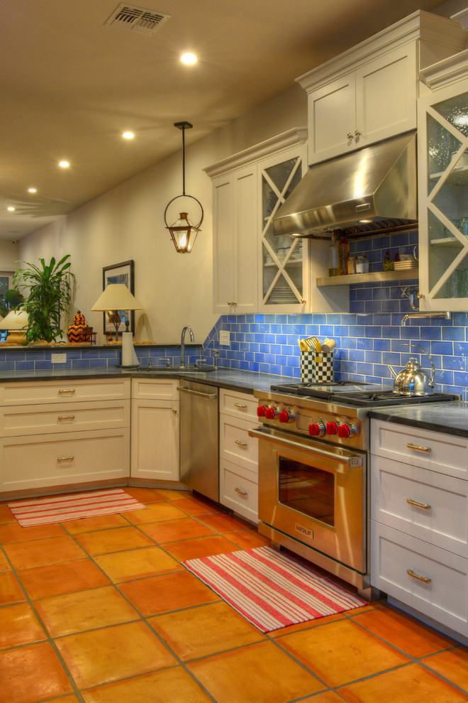 Example of a mid-sized transitional terra-cotta tile kitchen design in Phoenix with shaker cabinets, white cabinets, blue backsplash, stainless steel appliances and soapstone countertops