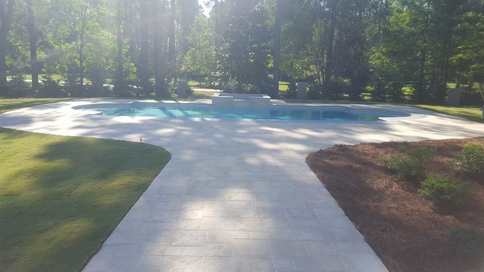 Patio fountain - large transitional backyard brick patio fountain idea with no cover