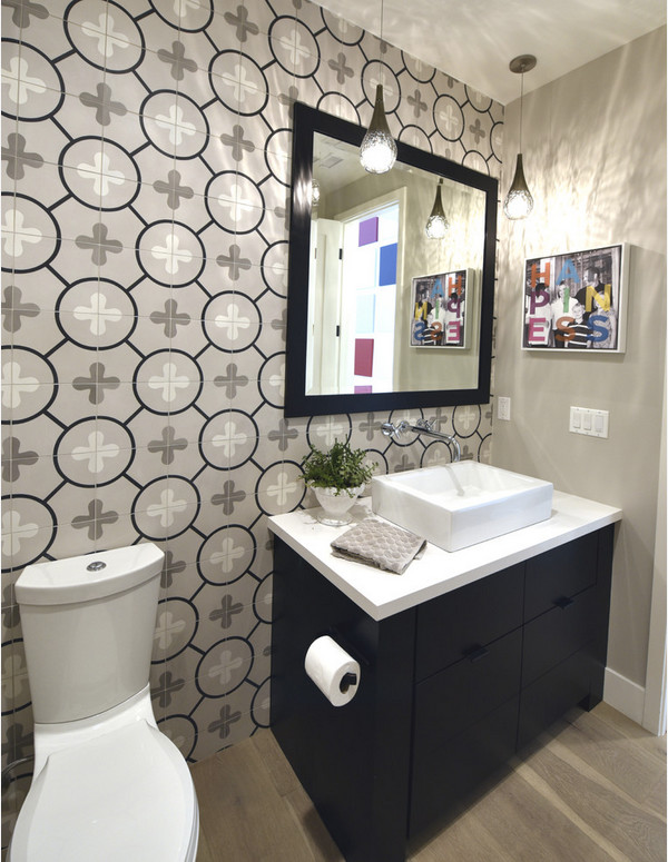 Inspiration for a small modern 3/4 bathroom in San Francisco with gray tile, cement tile, flat-panel cabinets, dark wood cabinets, a two-piece toilet, grey walls, light hardwood floors, a vessel sink and solid surface benchtops.