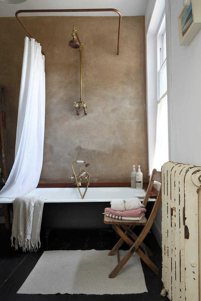 Photo of a traditional master bathroom in London with a shower/bathtub combo, brown walls and a shower curtain.