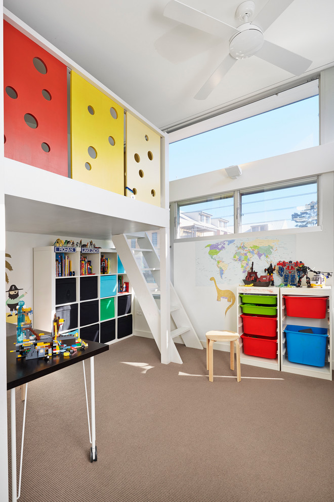 Design ideas for a contemporary gender-neutral kids' playroom for kids 4-10 years old in Sydney with carpet and white walls.