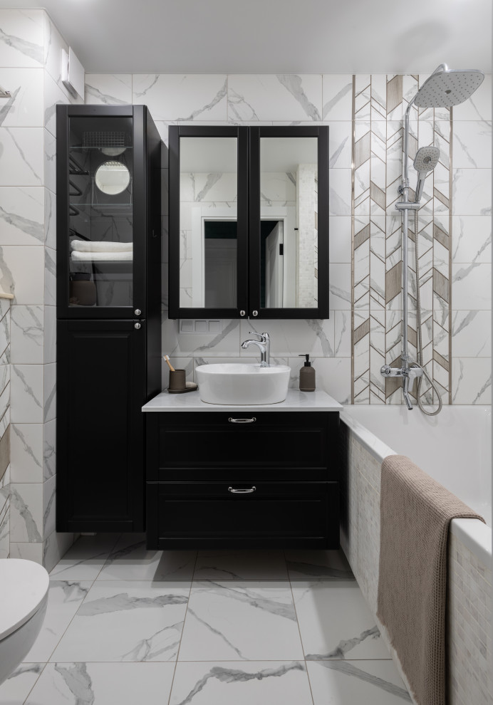 Design ideas for a small master bathroom in Moscow with recessed-panel cabinets, black cabinets, an undermount tub, a shower/bathtub combo, gray tile, ceramic tile, white walls, porcelain floors, a vessel sink, laminate benchtops, a shower curtain, white benchtops, a niche, a single vanity and a freestanding vanity.