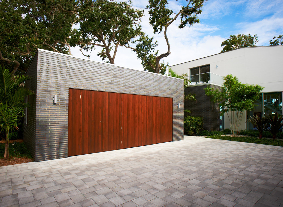 Photo of a modern detached two-car garage in Other.