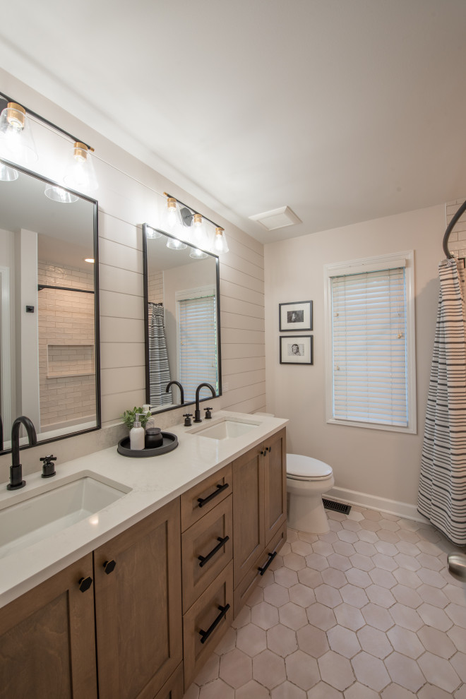 Photo of a small traditional family bathroom in Chicago with shaker cabinets, medium wood cabinets, an alcove bath, white tiles, ceramic flooring, a submerged sink, engineered stone worktops, grey floors, grey worktops, double sinks and a built in vanity unit.