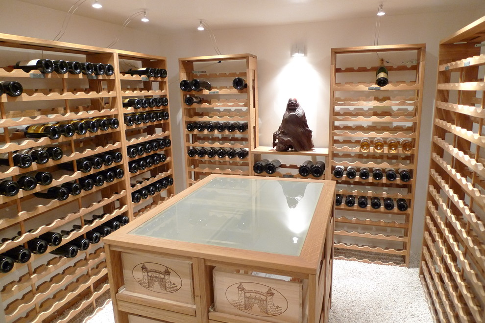 Photo of a small traditional wine cellar in Other with limestone floors, storage racks and white floor.