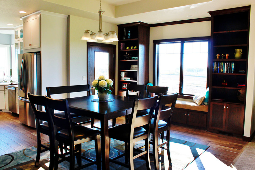 Kitchen/dining room combo - mid-sized transitional medium tone wood floor kitchen/dining room combo idea with beige walls and no fireplace