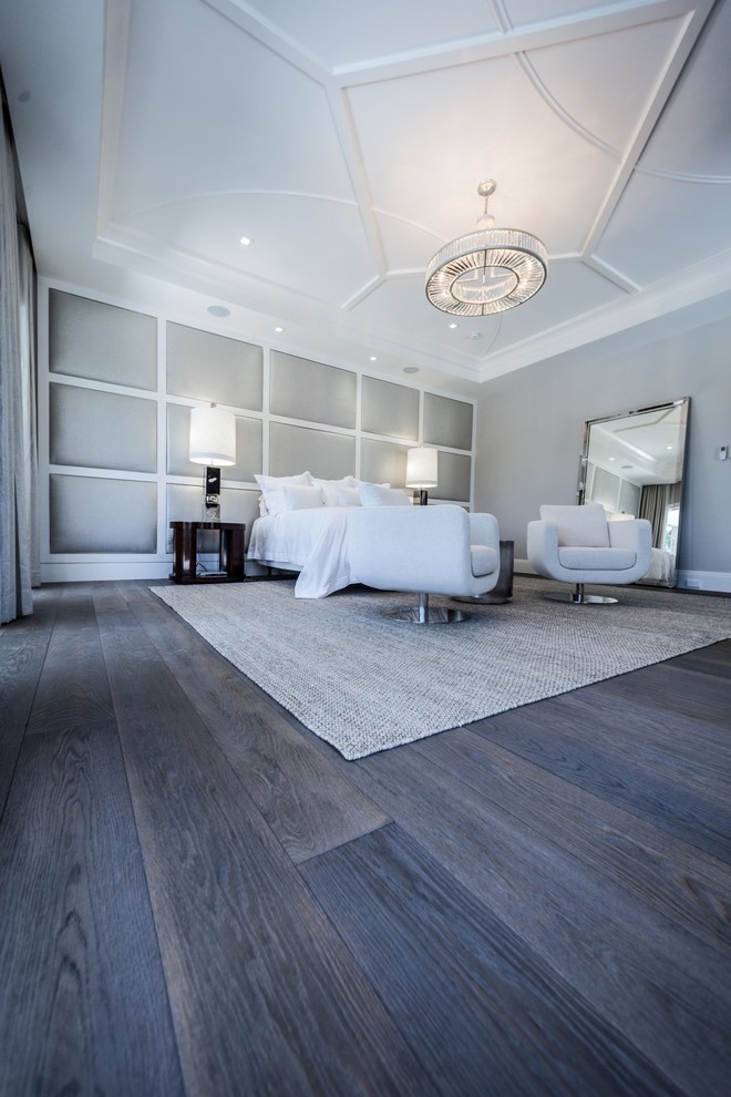 Photo of a contemporary bedroom in New York with dark hardwood floors.
