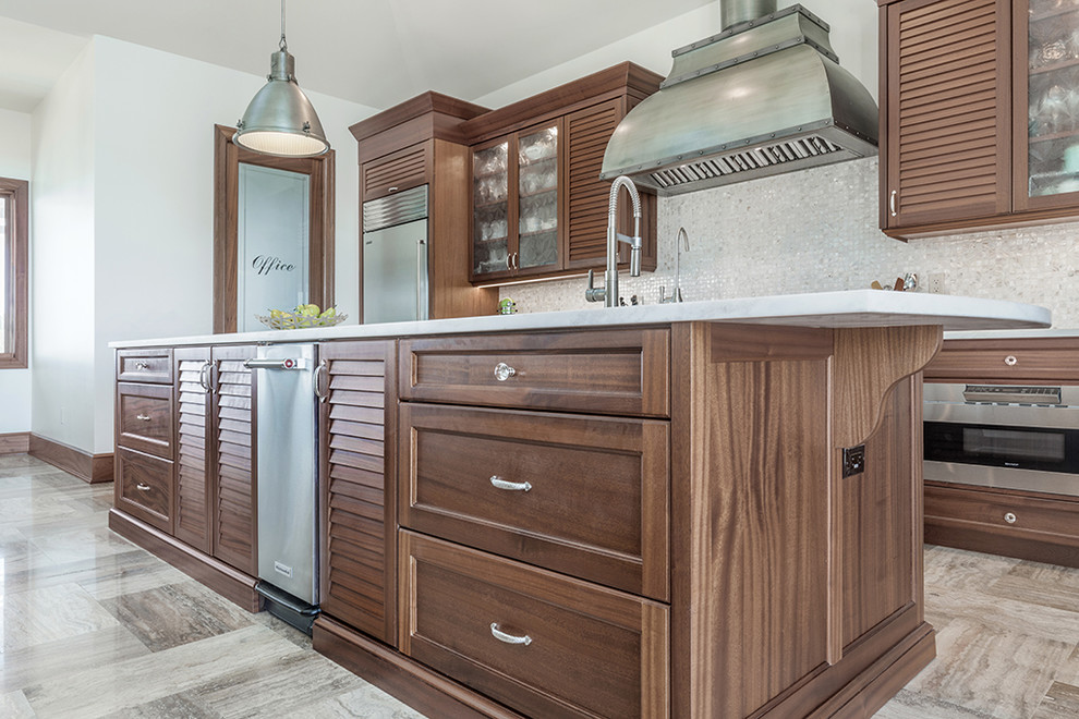 Inspiration for a large transitional kitchen in Tampa with a farmhouse sink, recessed-panel cabinets, medium wood cabinets, quartz benchtops, white splashback, mosaic tile splashback, stainless steel appliances, multiple islands and beige floor.