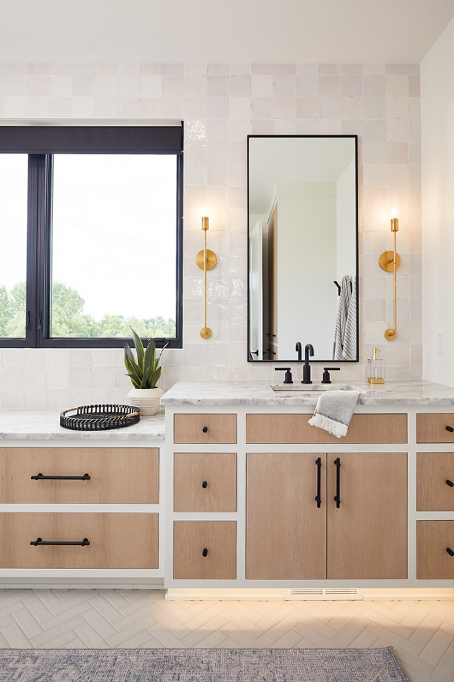 Bathroom - mid-sized contemporary master beige tile and ceramic tile porcelain tile, beige floor and single-sink bathroom idea in Grand Rapids with flat-panel cabinets, light wood cabinets, white walls, marble countertops, gray countertops, a built-in vanity and an undermount sink