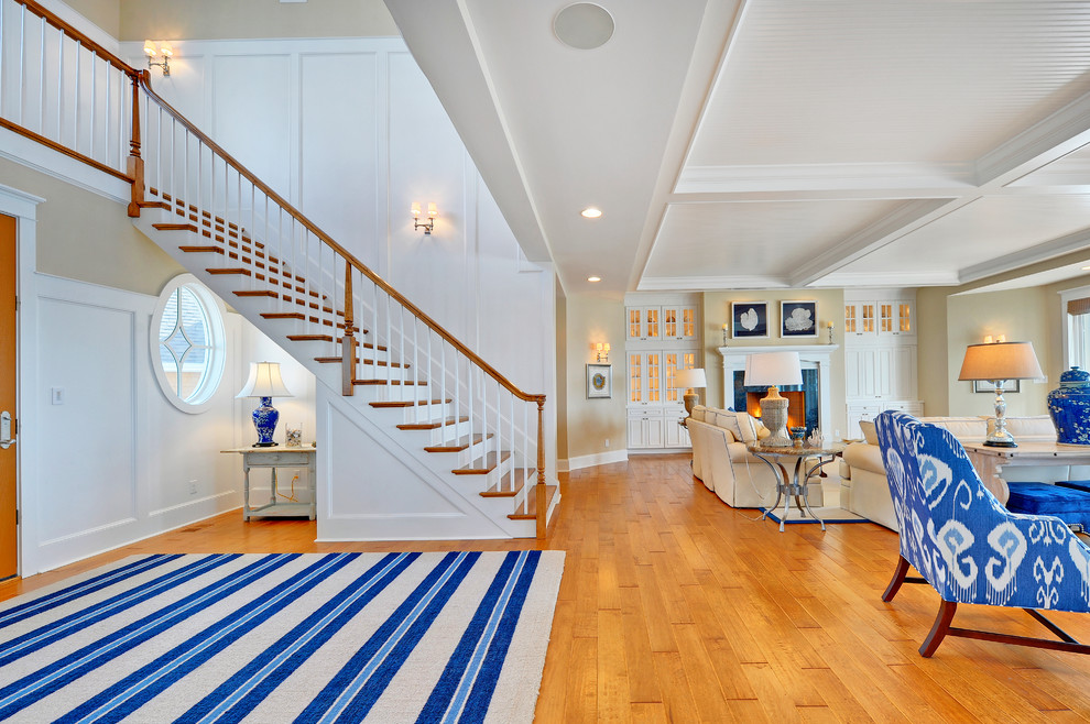 Beach style wood straight staircase in Philadelphia with painted wood risers.