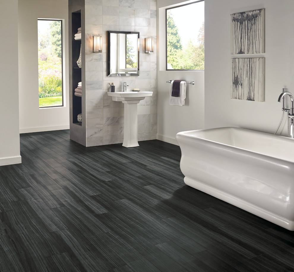 Inspiration for a large transitional master bathroom in Other with open cabinets, a freestanding tub, white walls, vinyl floors, a pedestal sink, grey cabinets, gray tile, white tile, stone tile, a shower/bathtub combo, black floor and an open shower.