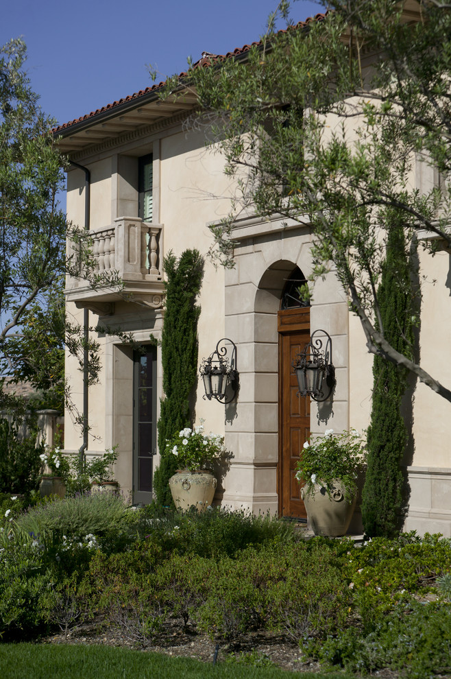 Inspiration for a mediterranean two-storey exterior in Orange County.