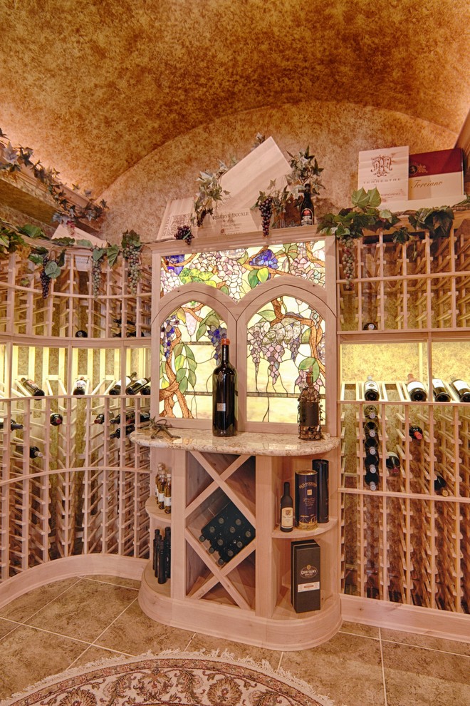 Design ideas for a large mediterranean wine cellar in Kansas City with porcelain floors and display racks.
