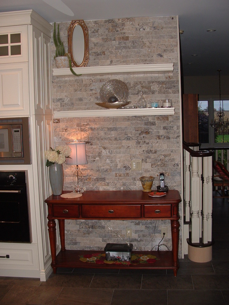 Inspiration for a mid-sized transitional slate floor and brown floor hallway remodel in Toronto with gray walls
