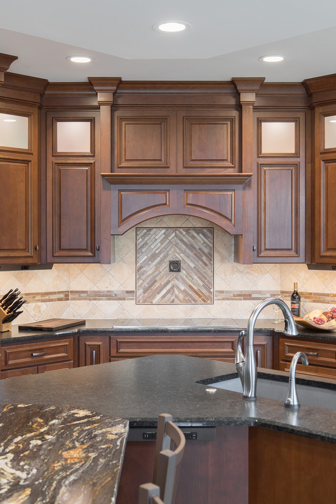 Large transitional kitchen photo with an undermount sink, raised-panel cabinets, stainless steel appliances and an island
