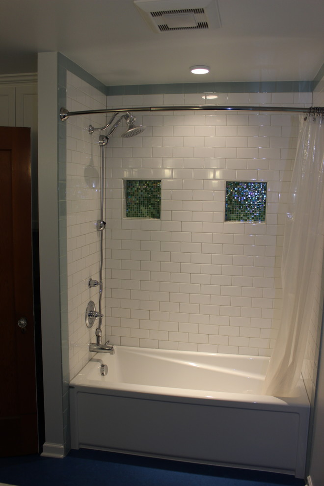 Small midcentury bathroom in Portland with shaker cabinets, white cabinets, an alcove bath, a shower/bath combination, a one-piece toilet, green tiles, glass tiles, grey walls and lino flooring.