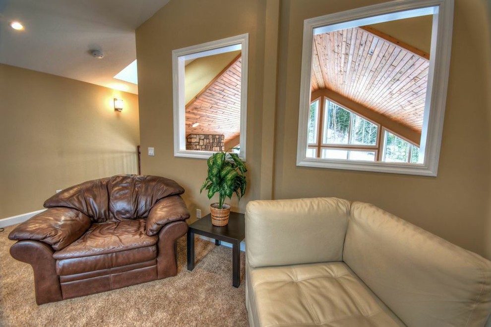 Example of a mountain style home design design in Calgary