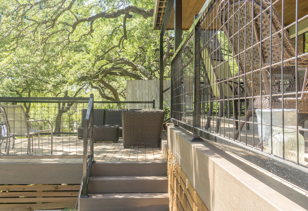Deck - large rustic backyard balcony deck idea in Austin