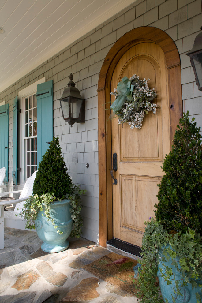 Traditional front door in Jacksonville with a single front door and a medium wood front door.