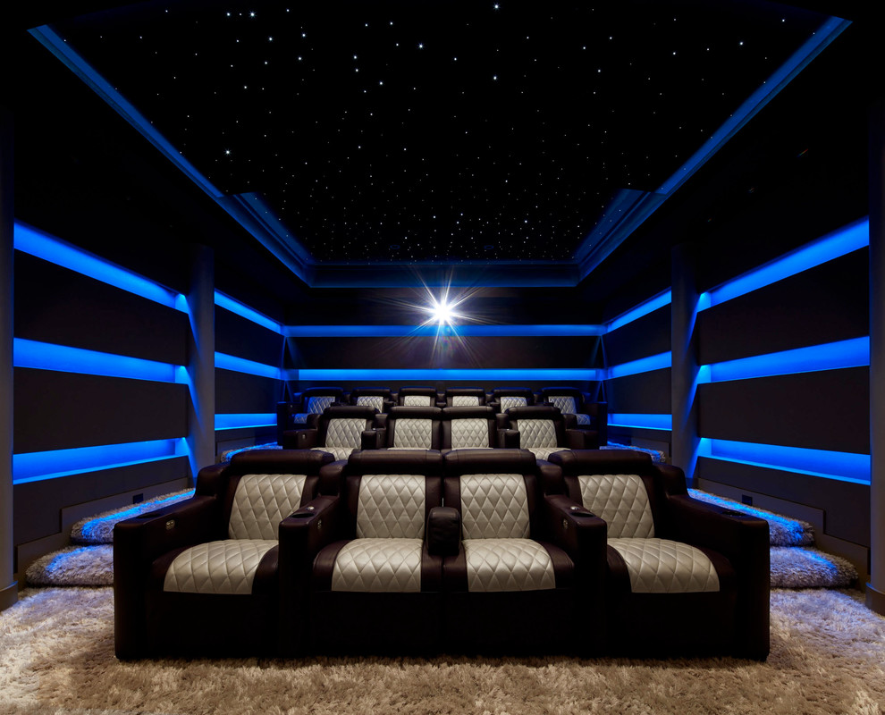 Inspiration for a large contemporary enclosed home theatre in New York with grey walls, carpet, a projector screen and beige floor.