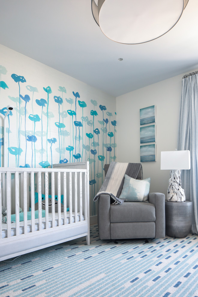 Design ideas for a mid-sized beach style nursery in New York with beige walls and carpet.