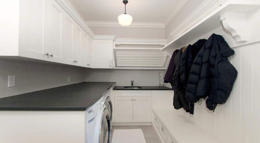 Transitional laundry room in Vancouver.