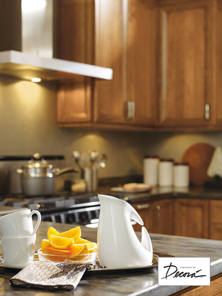 Eat-in kitchen - small l-shaped eat-in kitchen idea with medium tone wood cabinets, stainless steel appliances, a peninsula and gray countertops
