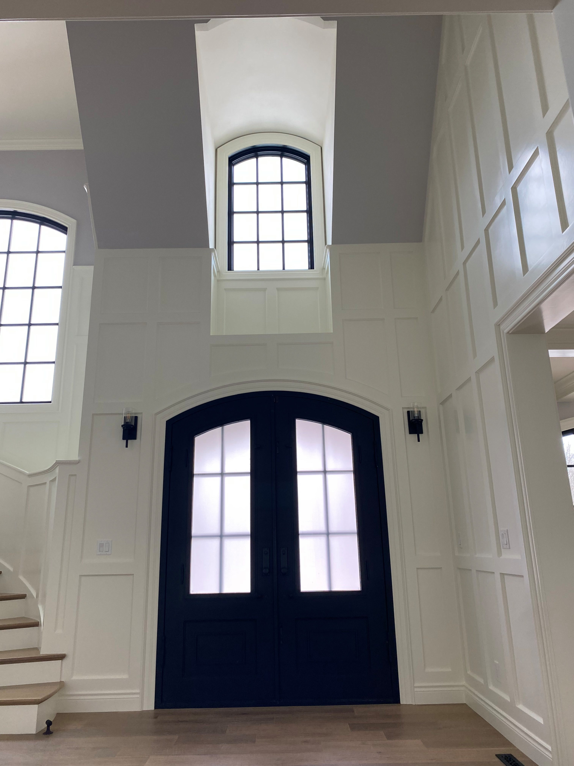 2-story entry with white painted Wainscoting