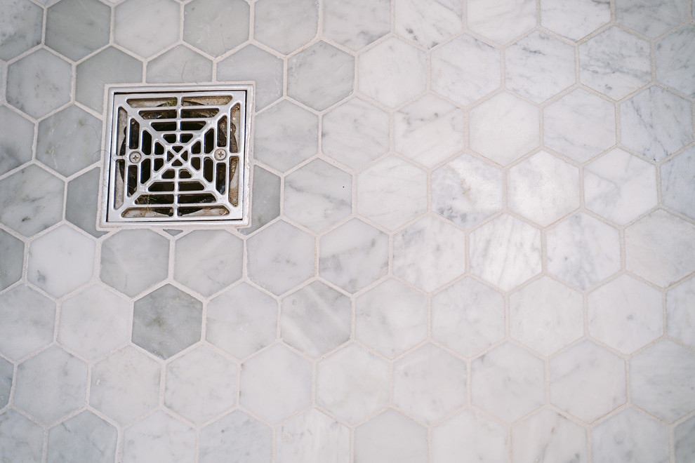 Large transitional master gray tile and marble tile marble floor and gray floor walk-in shower photo in Cincinnati with recessed-panel cabinets, gray cabinets, white walls, an undermount sink, marble countertops, a hinged shower door and gray countertops