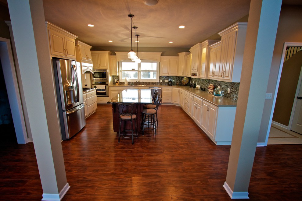 Open concept kitchen - mid-sized open concept kitchen idea with raised-panel cabinets, dark wood cabinets, granite countertops and an island