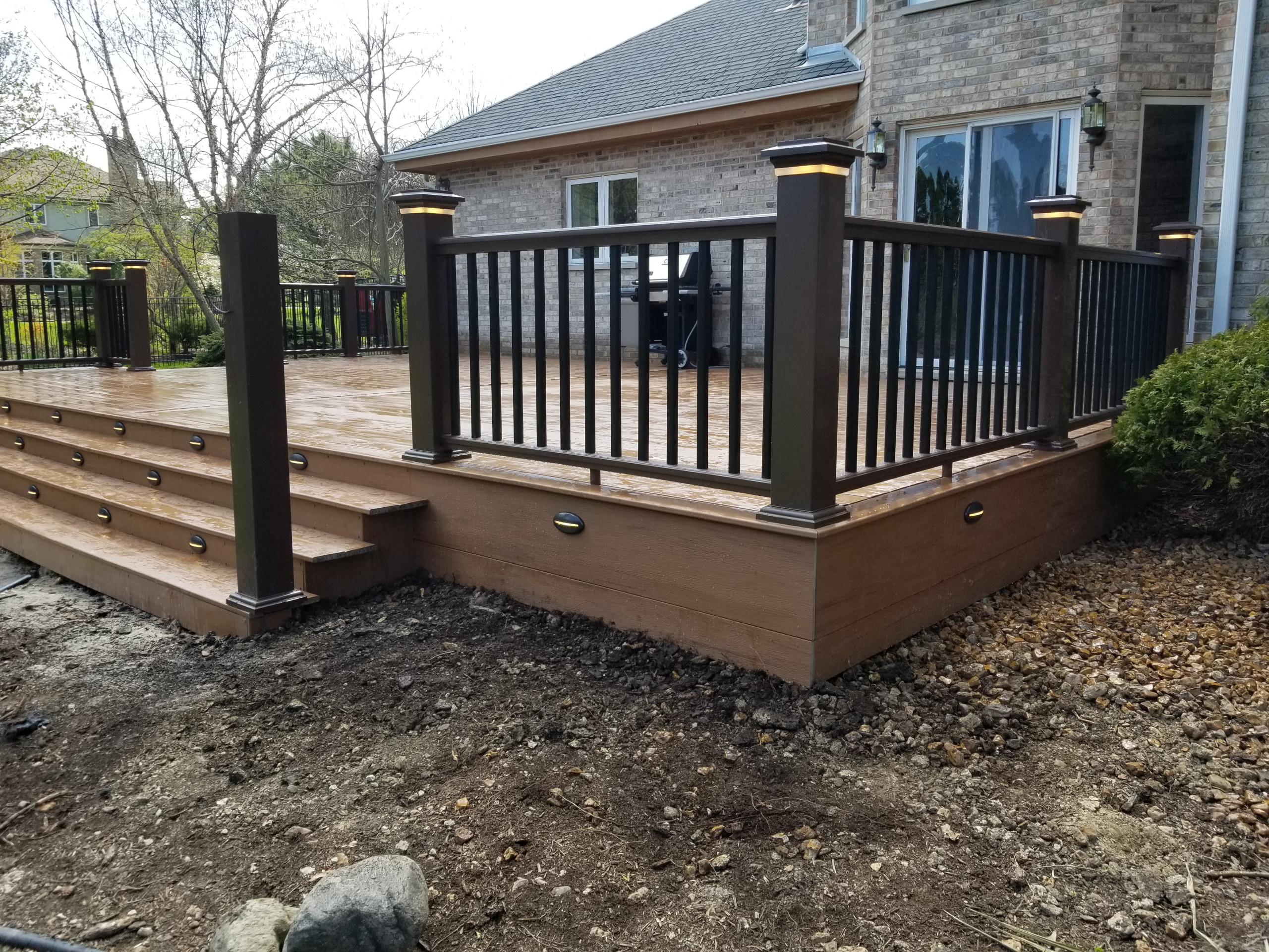 Composite deck with composite railing and lighting