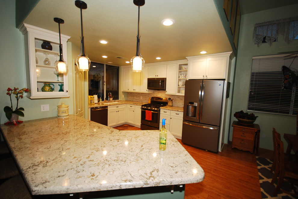 Inspiration for a transitional kitchen remodel with flat-panel cabinets and white cabinets