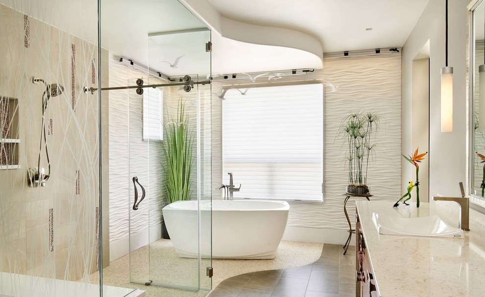 Inspiration for a large contemporary master bathroom in Denver with a freestanding tub, a curbless shower, white tile, a sliding shower screen, a vessel sink, grey floor and beige benchtops.