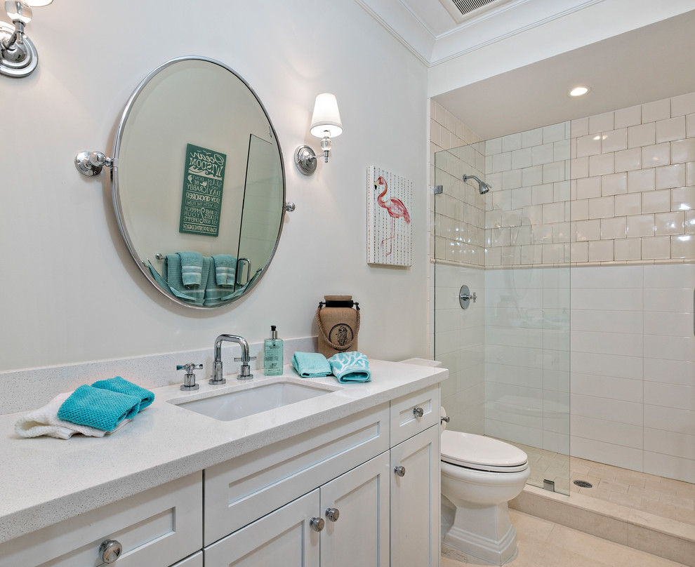 Design ideas for a large transitional master bathroom in Miami with shaker cabinets, white cabinets, an open shower, a two-piece toilet, white tile, subway tile, white walls, marble floors, an undermount sink, marble benchtops, beige floor and a hinged shower door.