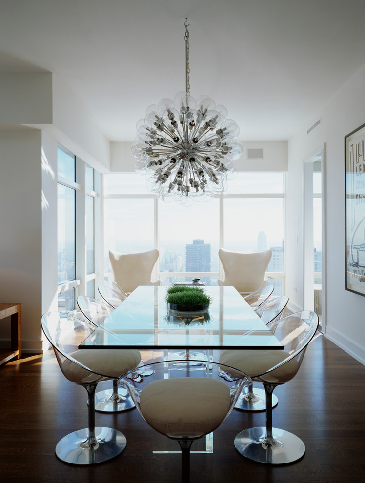 Photo of a contemporary open plan dining in New York with white walls, medium hardwood floors and no fireplace.