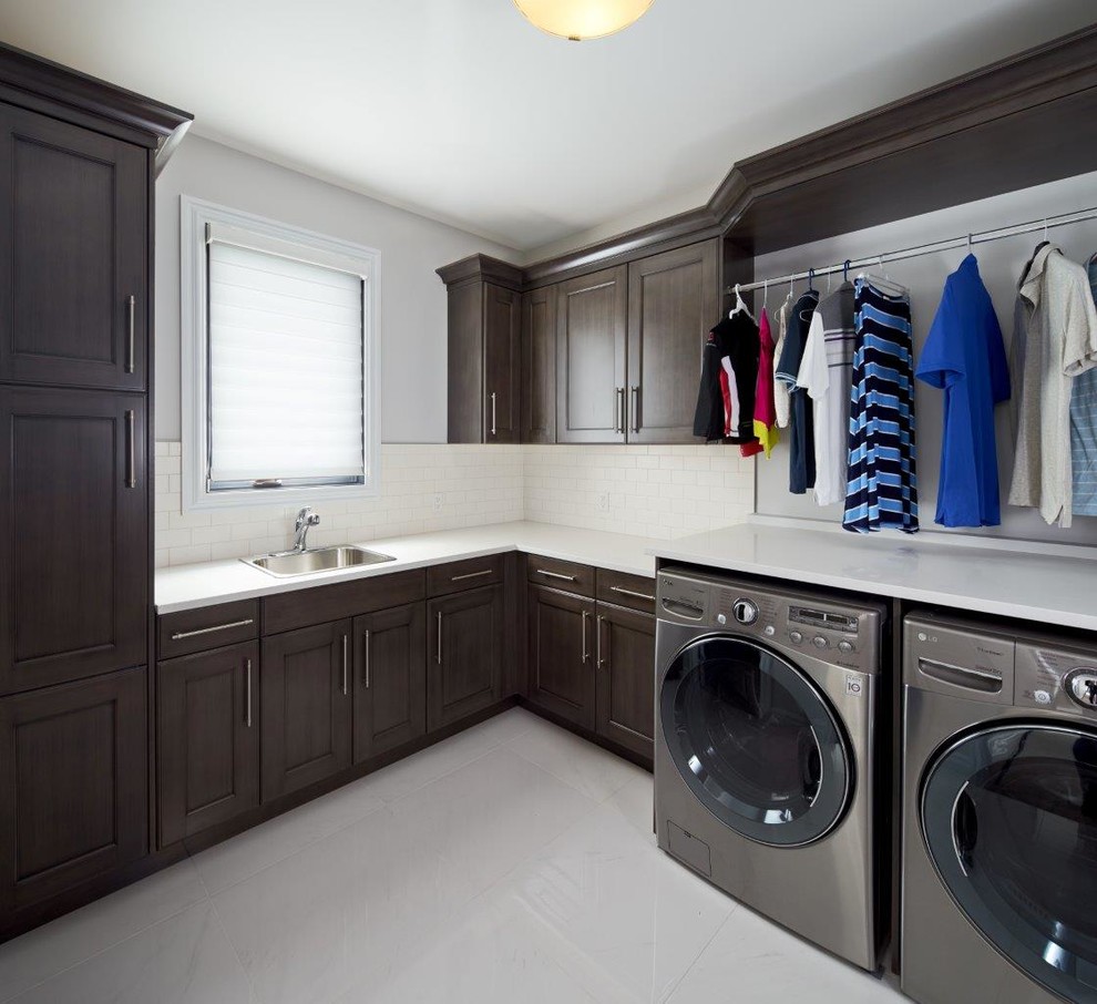 Example of a transitional laundry room design in Calgary