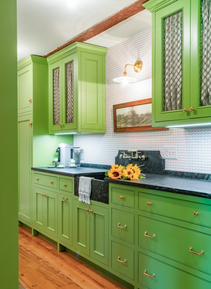 Inspiration for a transitional kitchen pantry in Boston with an integrated sink, recessed-panel cabinets, green cabinets, soapstone benchtops, coloured appliances, no island, black benchtop and vaulted.