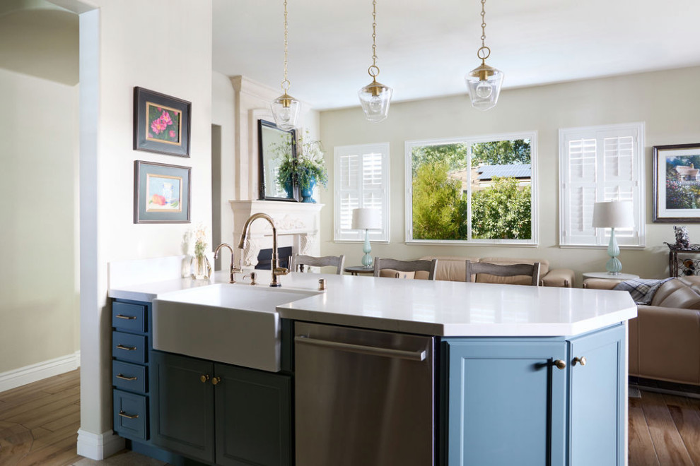 Inspiration for a medium sized kitchen in Sacramento with a belfast sink, blue cabinets, quartz worktops, multi-coloured splashback, stone tiled splashback, stainless steel appliances and white worktops.